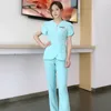 Wholesales women wear stylish scrub suits hospital uniform pant suits solid color unisex operating uniform 220610