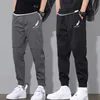 Herr sweatpants joggare män lösa lastbyxor fickor spår taktiska casual techwear manliga byxor sport streetwear 220325