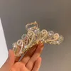 2021 Nouveau élégant Gold Hollow Geometric Metal Claw Vintage Coiffes Clips for Women Band Band Clair Hair Crab Hair Accessoires 5450367
