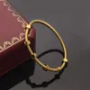 2023 Brand Classic Cuff Armband för kvinnor Personlig skruvdesigner Armband Fashion Par 18K Guld rostfritt stålarmband för män