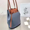 Designer Bag Top Quality Lychee DrawString Bucket Tote Color Matching Handväskor Kohide DrawString Bucket Casual Lady Shopping Purse 240325