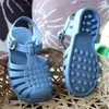 Ny sommar barn baby sandaler barn pojkar tjejer gelé strand skor romerska ihåliga spädbarn toddler sandal