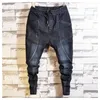 Jeans para hombres Moda para hombres Tendencia para hombre Elástico Harem Cordón Cómodo Rasgado Desgastado Patchwork Cuffed Denim Joggers para