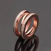 Anéis de casamento de casal fashion para homens e mulheres, marca clássica, designer oco, anel de diamante, anel de aço inoxidável 316L de alta qualidade, presente de joias