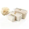 Bolsa de maquillaje de cuero PU de color sólido para mujeres con cremallera grandes bolsas cosméticas femeninas de viaje