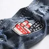 Мужские джинсы Мужские отверстия изнасилованы хип -хоп, разорванные вышитые флаг, краска, джинсовые брюки синяя стройная уличная одежда.