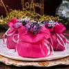 Emballage cadeau élégant Bouquet de fleurs de rose artificielle Pagnière de fil de fils Favoule Sacs de bonbons pour décorations de table de fête 100 sets