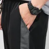 Pantaloni da uomo coreani estivi con giunture sottili a 9 punti Pantaloni casual con gamba elastica allentata in seta di ghiaccio Tendenza di ventilazione 220816