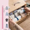 Kleding Garderobe Opslag Draagbare doek Pant Bindingsriem Zelfklevende Sweater Lazy Roll Belt Creative Elastische riemen Travel Acc