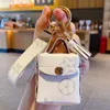Designer Airpods Cases Keychains Rings Fashion Brown Flower Key Chains Women PU Leather Pendant Bag Charms Keyring Trinkets Car Keyfobs Holder Jewelry Accessories
