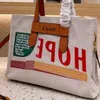 Designer Large Woody 2024 Tote Bag Handtas Zomer Tote Canvas Vrouwelijk woon -werkverkeer Cloe Bags Capaciteit 9G9Z