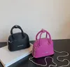 Moda bambini borsa a conchiglia per bambini PU Borse a tracolla in pelle con catena per ragazze borsa principessa a spalla singola color caramella