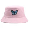 chapeau papillon bleu