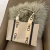 Japanse Tote Toes Hands Outlet 2024 Cloee Leisure Designer Bags Canvas Woody Bag Zomer Gedrukte brief Winkelen Grote capaciteit Fashio 011s