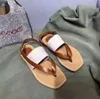 Flache Damenschuhe Woody, flache Mule-Sandalen von Grove, braune Slides aus Kalbsleder, Canvas-Slipper, weiche Schuhe mit bestickter Gummiunterseite und hellbraunem Aufdruck