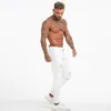 Jeans pour hommes GINGTTO blanc hommes taille haute déchiré maigre serré mâle Super pulvérisation sur pantalon goutte grande taille 36 Zm55