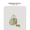 가방 여성 2022 봄 새로운 소수 민족 디자인 캔디 컬러 핸드백 트렌드 패션 단일 어깨 메신저 베개 가방