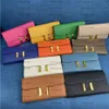 Designer Purse Togo woman Wallets Gold Buckle Whole cowskin Card holders Bags fashion Genuine leather Long wallet For lady 11 Colors 539