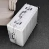 Snugcozyアルミニウム材料サイズパーフェクトトラベル荷物スピナーブランド高品質のスーツケースJ220708 J220708