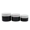 Emballage cosmétique Pots de crème en verre noir brillant Bouteille rechargeable Couvercle blanc Pots de crème pour le visage vides portables de haute qualité 20g 30g 50g