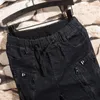 Calças de brim masculinas moda masculina tendência elástica harem cordão confortável rasgado angustiado retalhos algemados denim corredores para