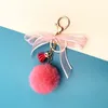 Keychains Creative Keychain Leuke kwastje boog haar kogel auto sleutel ketting fruit kleurtas hanger pluche kleine geschenkaccessoires