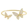 Bangle anlände Micro Pave Clear CZ Double Butterfly Charm Öppen justerad för kvinnor Iced Out Bling 5A Fashion Jewelrybangle