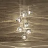 Ny Creative Crystal Chandelier Luxury Staircase Hängande LED -lampor Metallchassi för trapploftlobby Villa vardagsrum