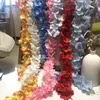 DIYシミュレーションのための人工アジレアウィステリアの花ウェディングアーチラッタンウォールハンギングホームパーティーの装飾偽の花