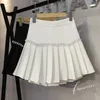 Preppy Style Białe plisowane liniowe taniec mini spódnice kobiety wiosna letnia kieszonkowa kieszonkowa puchowa krótka spódnica 220701