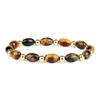 Moda Proteggi i braccialetti per la salute Donna Occhi di tigre naturale Perline di semi di pietra Gioielli Energia Ematite Healing Bracciale Reiki Uomo