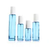 Emballage Vide Verre Clair Bleu Bouteille Épaule Plate Couvercle Blanc Blanc Presse Pompe Portable Rechargeable Emballage Cosmétique Conteneur 20 ml 30 ml 40 ml 60 ml 100 ml 120 ml