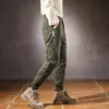 Calça masculina cargo masculino harém de retalhos de retalhos verde alongamento masculino calça de streetwear com faixas de streetwar