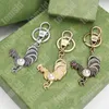 Kadınlar için Anahtarlık Erkekler Moda Şeytan Gümüş Altın Toka Paslanmaz Çelik Tasarımcı Anahtarlıklar Yeşil Kutu ile Yüksek Kaliteli Tahrik Anahtar Yüzüğü