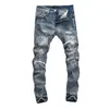 Jeans da uomo europei Jean AM lettera ricamo uomo patchwork strappato per pantaloni da motociclista di marca di tendenza da uomo skinny