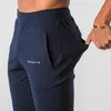 Muscle Fitness Running Training Pantaloni sportivi in cotone Pantaloni da uomo casual traspiranti con bocca a fascio sottile 220810