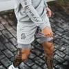 Europeiska och amerikanska modemärke Sport Doubledecker Shorts Män Tränar FAKE 2 -stycken Basket Running Fitness Pants 220526