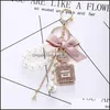Keychains Fashion Accessoires Creative Handmade Diy Diamond per fles Alloy Bow Pearl Luxe Keychain Portemonches Charm Pendant YS068 3505627