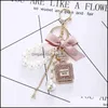 Keychains Fashion Accessoires Creative Handmade Diy Diamond per fles Alloy Bow Pearl Luxe Keychain Portemonches Charm Pendant YS068 9530639