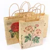 Bolsa de papel de papel de embrulho de presente Kraft com alças de padrões de rosas recicláveis ​​100pcs/lotgift