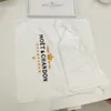 Gesticktes Moet Chandon Party-Service-Handtuch aus weißer Baumwolle5095975