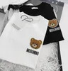 T-shirt moda per bambini Top Tees ragazzi ragazze cartoon orso ricamato lettera cotone manica corta Pullover abbigliamento per bambini Stile sciolto