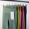 Pantaloni da yoga da donna Pantaloni sportivi da donna della linea di imbarazzo Pantaloni da ginnastica stretti a vita alta stretti da donna Pantaloni da ginnastica nudi Legging da palestra