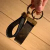2022 Dragonne Nyckelhållare Tillbehör Designer Floral Canvas Keychain Car Key Chain Ring Charm Pochette Accessoires ID Namn Tag Hot Stamping Stamp