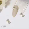 مجموعة من 20pcs 3D Bowknot Nail Art Decorations دخول لوكس سبيكة الأظافر الترتر الشارات الماس