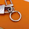 Designer Alloy Keychain Keyring Fashion Purse Pendant Car Chain Charm Brown Flower Mini Bag Trinka Gifts Accessories Jone252413604