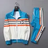 Projektant Mens Tracksuit Sets SPORT SUPER MĘŻCZYZN MĘŻCZYZNA KURSZYKÓW BUSKI KURSZYKÓW JOGGER Suits Spodnie Kurtka Zestaw Man Clothing Sporting Coats FG55