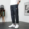 Ciemnoniebieskie dżinsy mężczyźni rozciągają luźne dopasowanie szeroką nogę wiosną lato swobodne spodnie haremowe elastyczne talii patchwork streetwearu obejmuje pasek CX220401