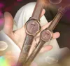 Crimen Pareja popular Mujeres Hombres Reloj 39 mm 32 mm Moda de lujo Mujeres Banda de cuero genuino Movimiento de cuarzo Reloj de pulsera de ocio Regalos de Navidad y San Valentín