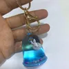 Keychains Creative Colorful Floating Keychain Cute 4 Style Moving Liquid Women Car Bag Pendant Gadgets Toys Gift KeychainKainKains Emel22